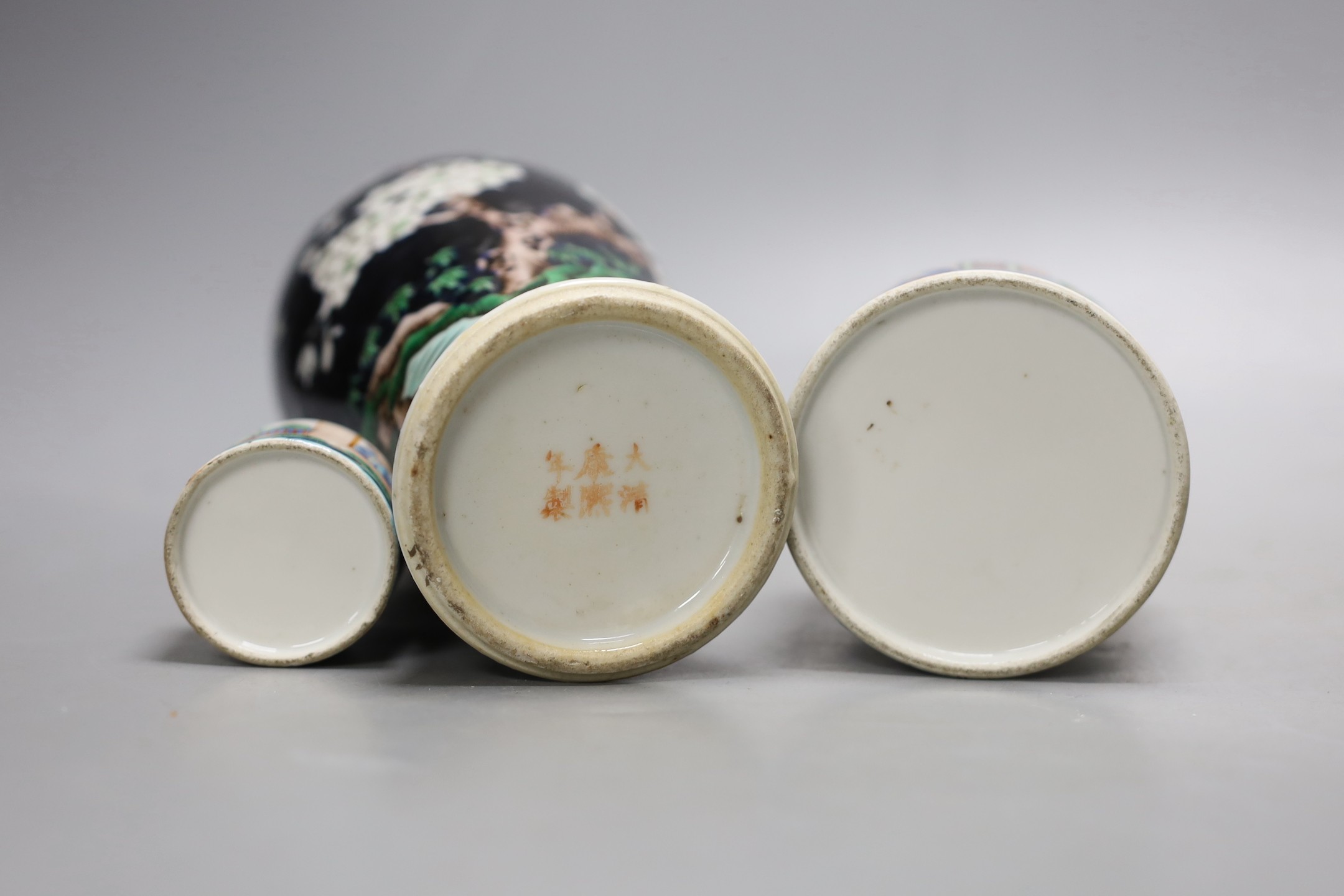 A Chinese famille noire vase, and two famille rose lidded pots, 19th century, Vase 12 cms high.